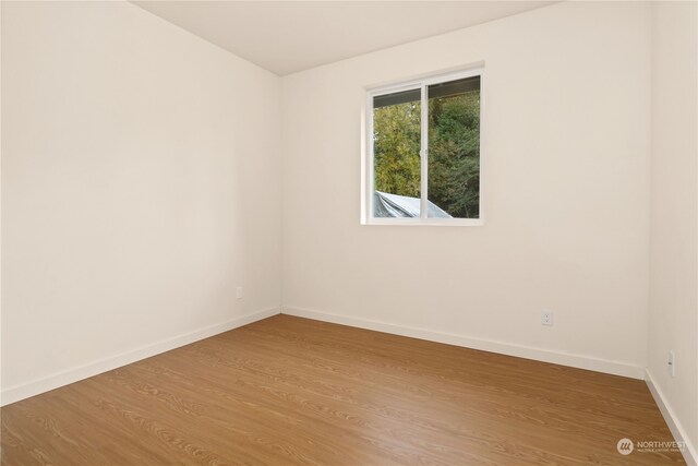 161 Oak St, Quilcene, WA 98376 - empty room featuring baseboards and wood finished floors