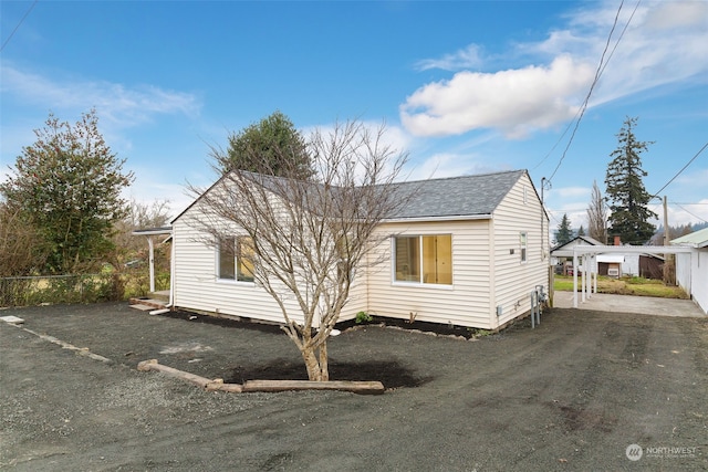 exterior space with a carport