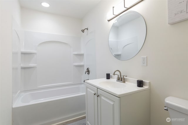 full bathroom featuring tub / shower combination, vanity, and toilet