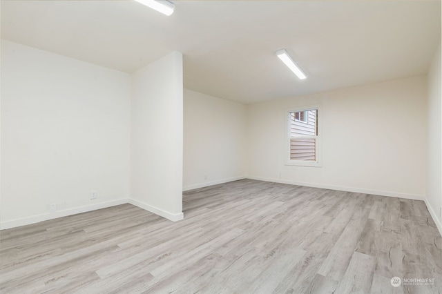 unfurnished room featuring light hardwood / wood-style flooring