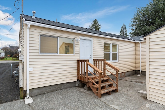 property entrance with a patio