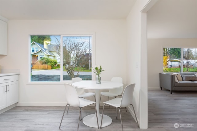 dining area with light wood-type flooring