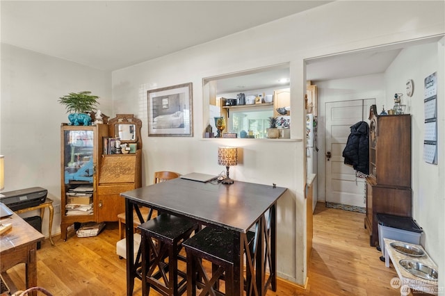 dining area with light hardwood / wood-style flooring