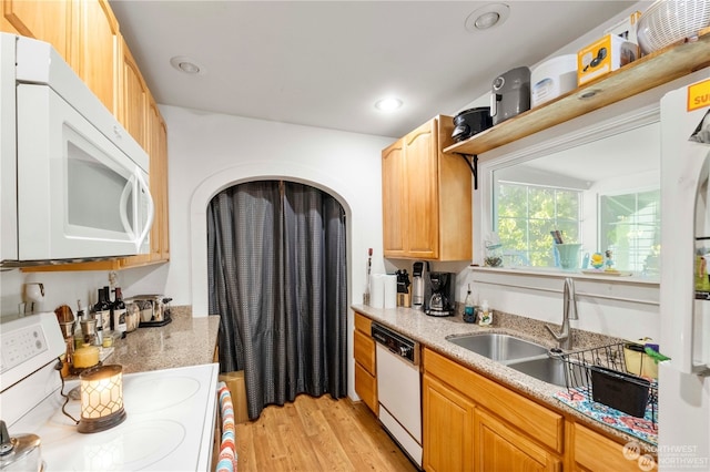 kitchen featuring light hardwood / wood-style floors, light brown cabinets, sink, and white appliances