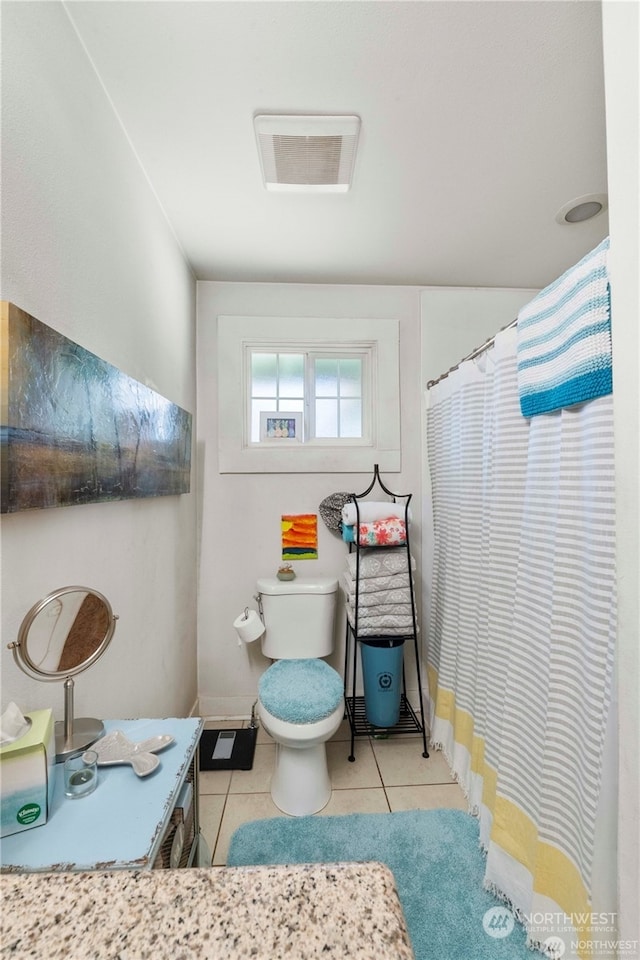 bathroom featuring vanity, toilet, and tile patterned floors