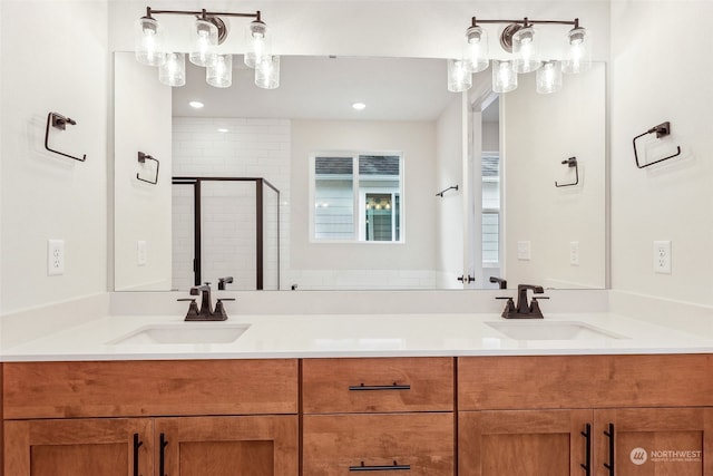 bathroom with vanity and a shower with shower door