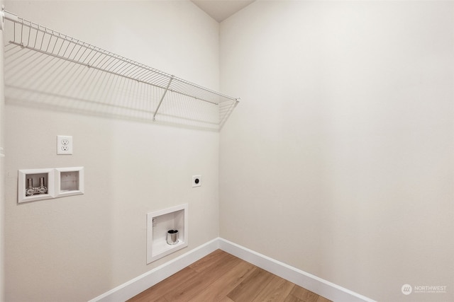 clothes washing area with hardwood / wood-style flooring, electric dryer hookup, and hookup for a washing machine