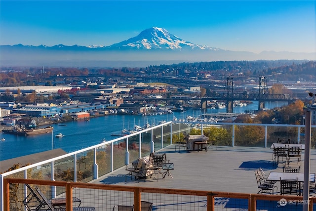 balcony with a water and mountain view