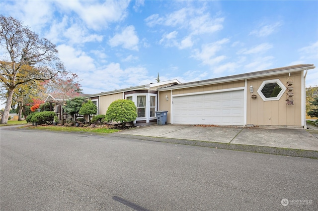 single story home featuring a garage