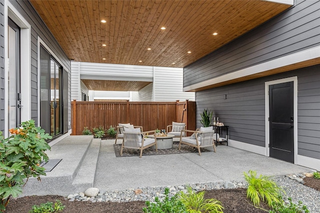 view of patio / terrace featuring an outdoor fire pit