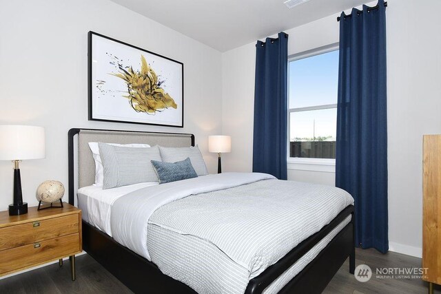 1121 SE 33rd St, Battle Ground, WA 98604 - bedroom with baseboards, visible vents, and wood finished floors