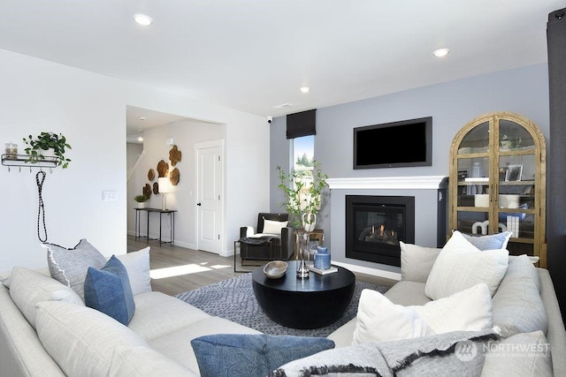 1121 SE 33rd St, Battle Ground, WA 98604 - living room with recessed lighting, baseboards, a glass covered fireplace, and wood finished floors