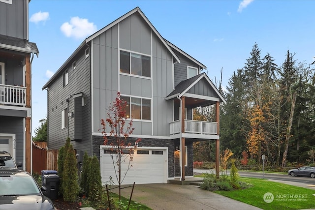 view of front of home featuring a garage and a balcony