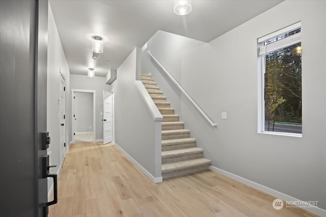 entryway with light hardwood / wood-style floors