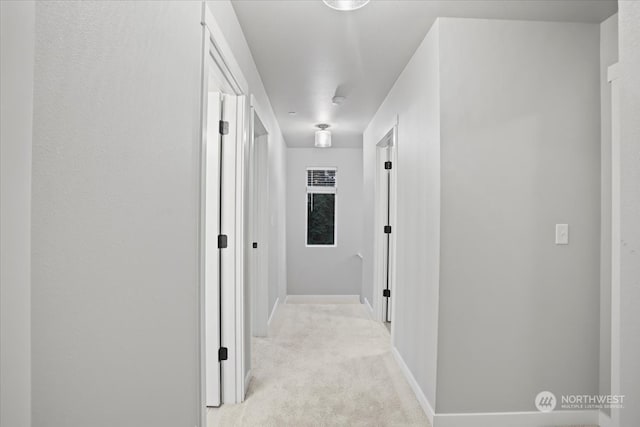 hallway with light carpet