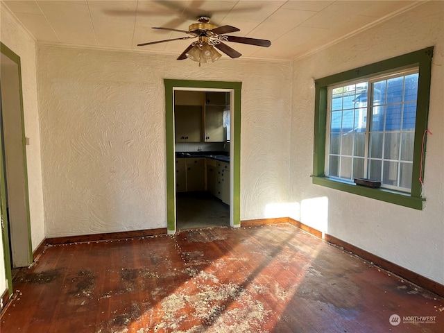 unfurnished room featuring ornamental molding, ceiling fan, and dark hardwood / wood-style flooring