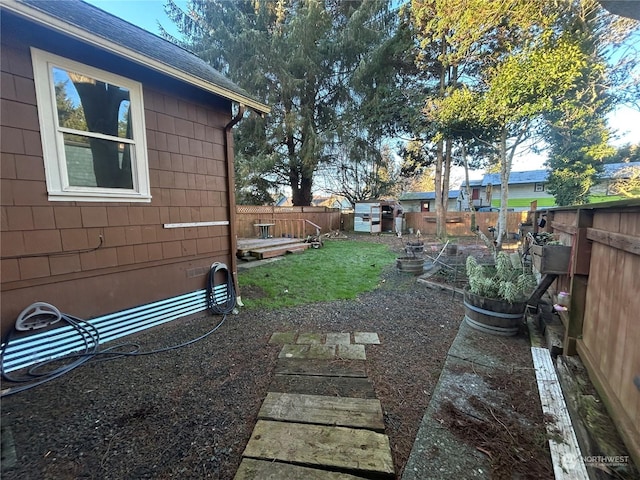 view of yard with a fenced backyard