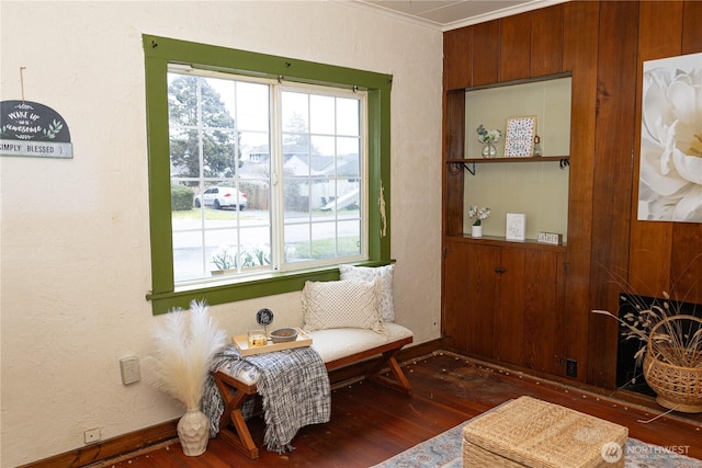 sitting room featuring baseboards, a fireplace, and dark wood finished floors