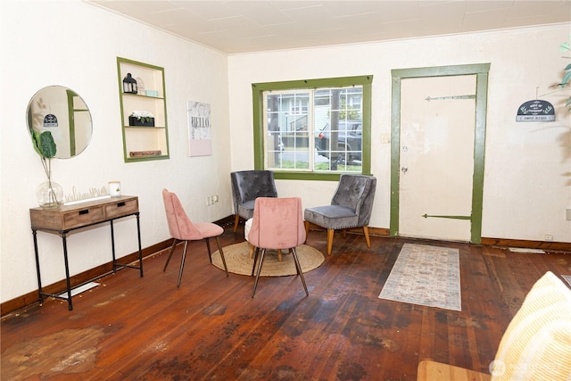 entrance foyer featuring baseboards, ornamental molding, and dark wood-style flooring