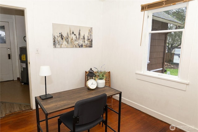 office area with water heater, baseboards, and dark wood-style flooring