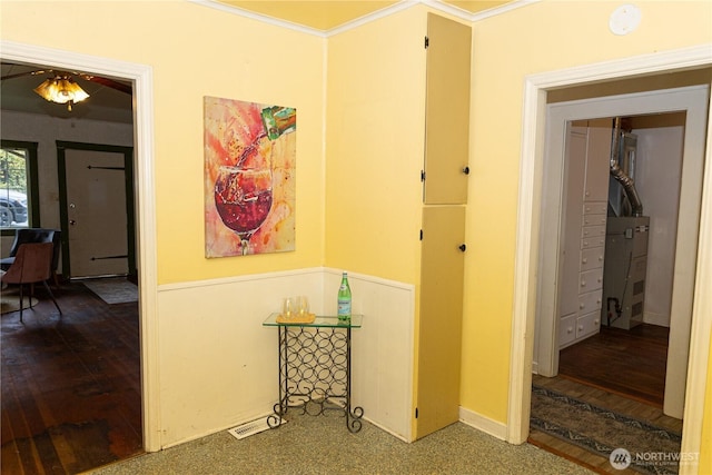 hallway featuring crown molding