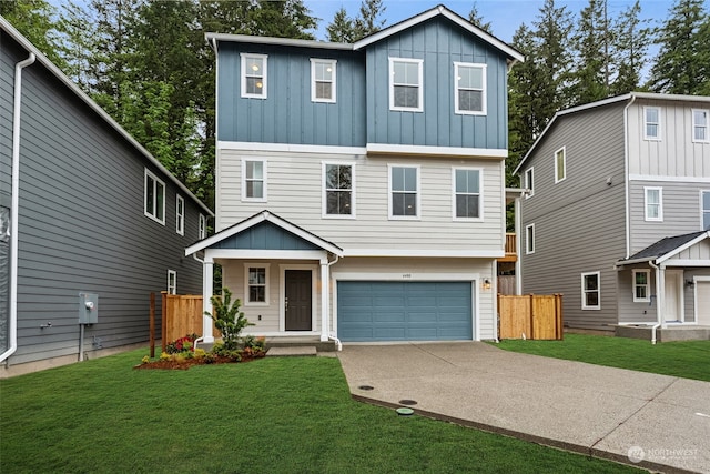 view of front of house featuring a front lawn and a garage