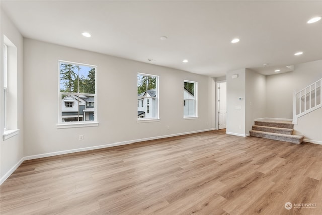 unfurnished living room featuring light wood-type flooring