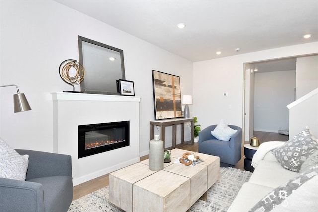 1112 SE 33rd St, Battle Ground, WA 98604 - living area with wood finished floors, a glass covered fireplace, and recessed lighting