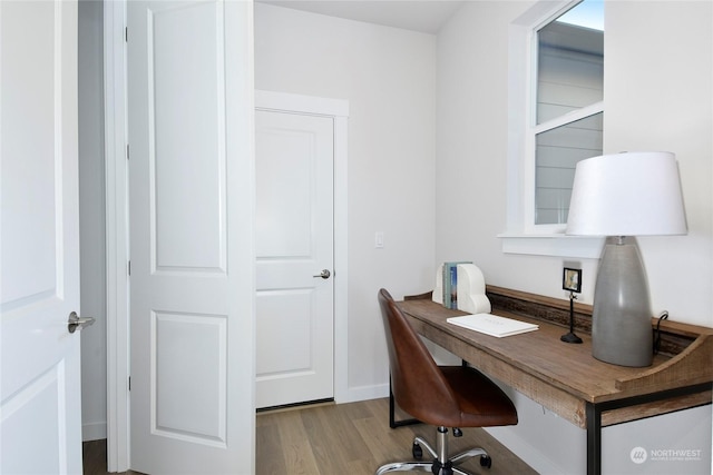 office area with light hardwood / wood-style flooring