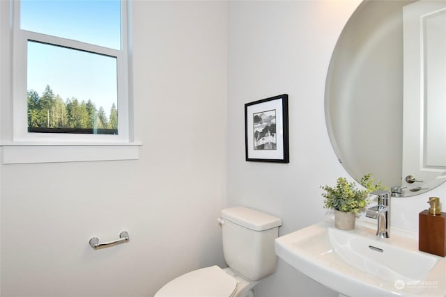 bathroom with sink and toilet