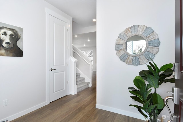 hallway with dark hardwood / wood-style floors