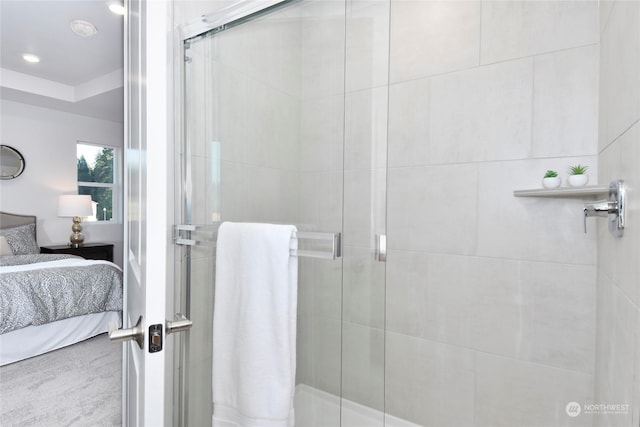 bathroom with a shower with shower door