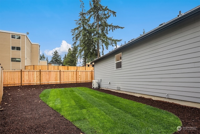 view of yard with a fenced backyard