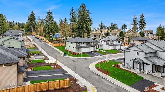 birds eye view of property with a residential view