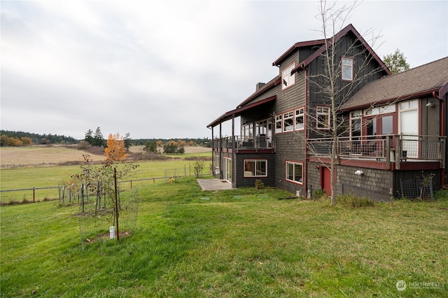 view of yard featuring a rural view and a deck