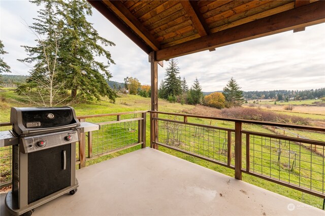 view of patio / terrace featuring a rural view and grilling area