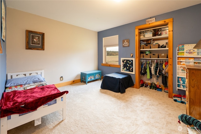 bedroom featuring carpet and a closet