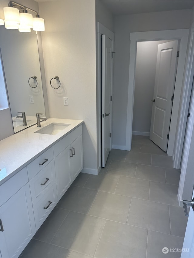 bathroom with tile patterned floors and vanity