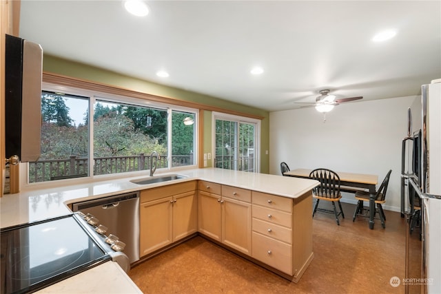 kitchen featuring light brown cabinets, sink, stainless steel dishwasher, ceiling fan, and kitchen peninsula