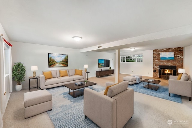 living room featuring light colored carpet and a brick fireplace