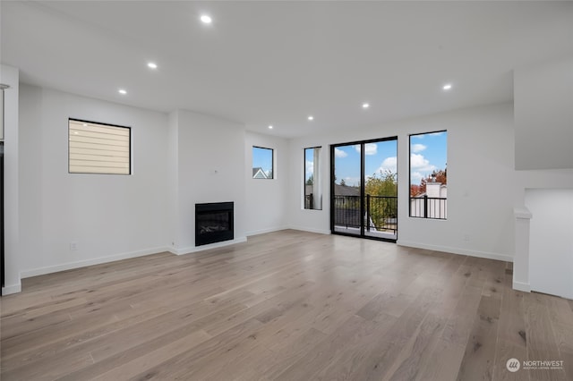 unfurnished living room with light hardwood / wood-style flooring