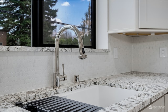 room details with light stone counters and white cabinets