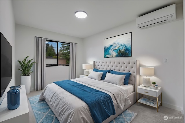 bedroom featuring an AC wall unit