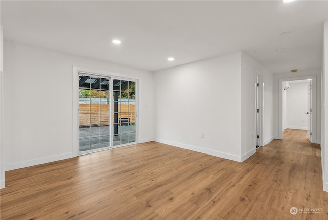 empty room with light hardwood / wood-style floors