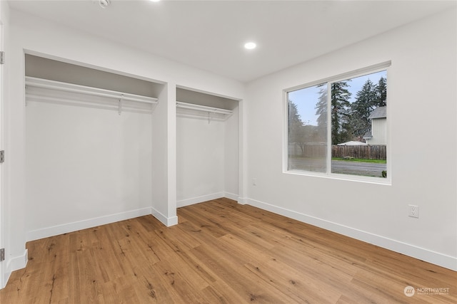 unfurnished bedroom featuring light wood-type flooring