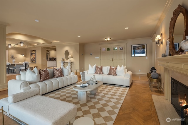 living room with light parquet floors and crown molding