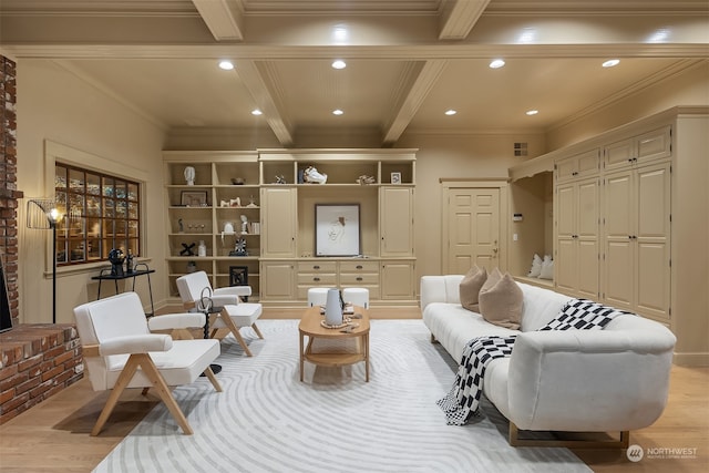 sitting room featuring beam ceiling, crown molding, and light hardwood / wood-style floors