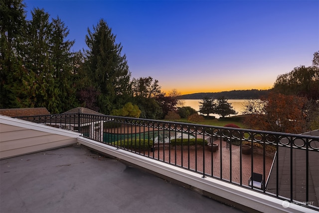 balcony at dusk with a water view