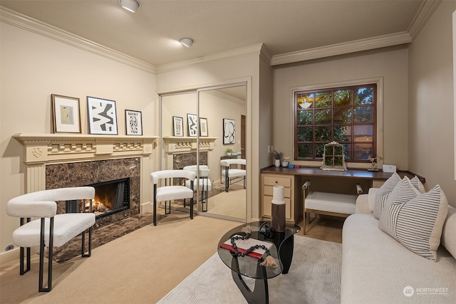 carpeted living room featuring ornamental molding and a high end fireplace