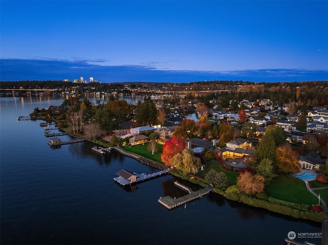 aerial view at dusk with a water view